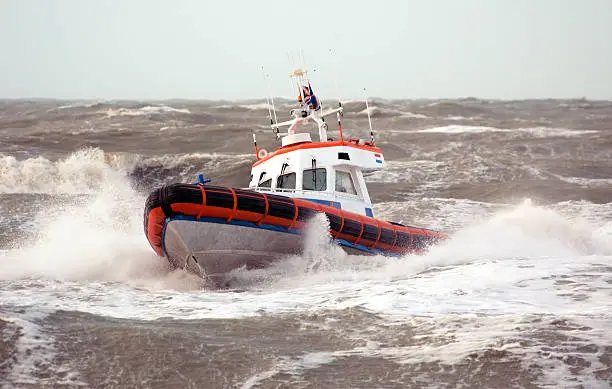 Photo of A coast guard ship on breaking waves