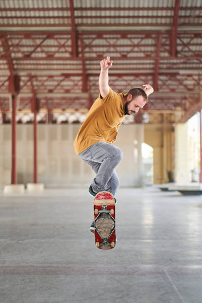 istock Young man doing an ollie with his skateboard 1403975487