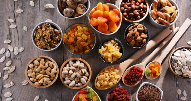 istock Composition with dried fruits and assorted nuts. Delicacies 1403976174