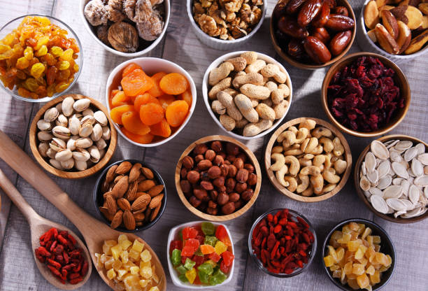 istock Composition with dried fruits and assorted nuts. Delicacies 1403976242
