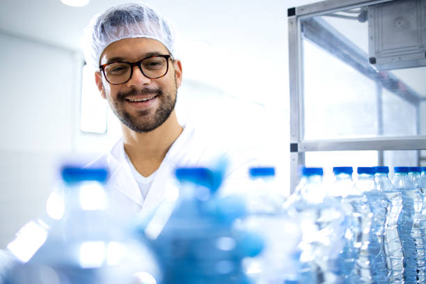 istock Industrial production of drinking water in PET packaging. 1403976729