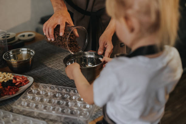 istock Mom and daughter make chocolate at home 1403976801