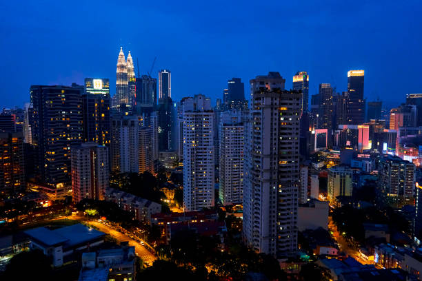 Scenery evening view downtown of modern megapolis. Kuala Lumpur, Malaysia - 04.01.2020