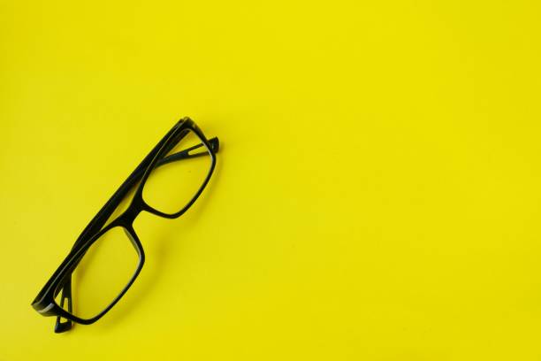 istock sunglasses isolated on yellow background 1403979687
