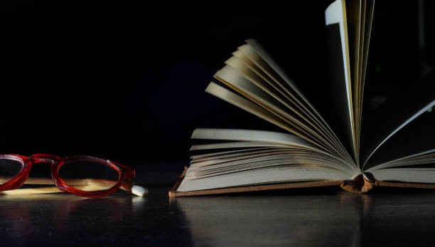 istock open book and spectacles, reading, education, education concept,  selective focus, free copy space 1403980696