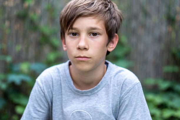 istock Portrait of a serious boy looking at camera 1403981656