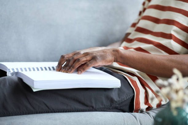 istock Man Reading Book in Braille Side View 1403981898