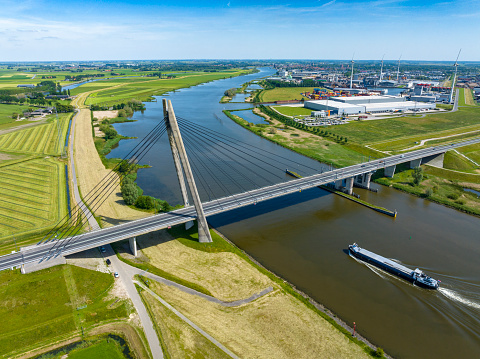 Overhead drone view on the Eilandbrug over the river IJssel with the N50 highway. The bridge is located near Kampen in Overijssel, The Netherlands.