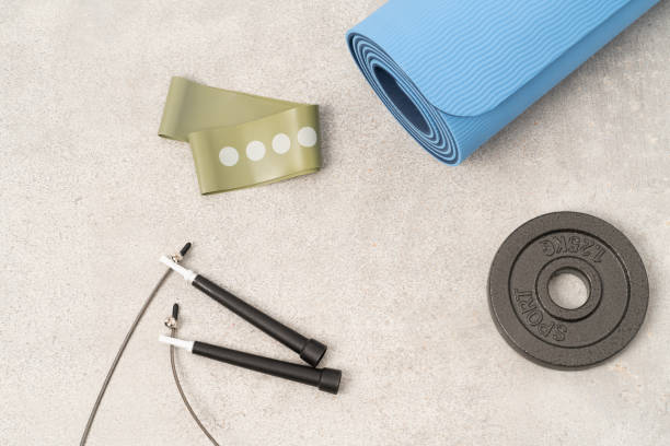istock Workout equipment, exercise mat, jumping rope, bands, weights 1403984200