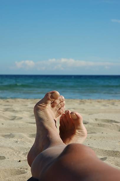 istock my happy legs on the beach 140398559