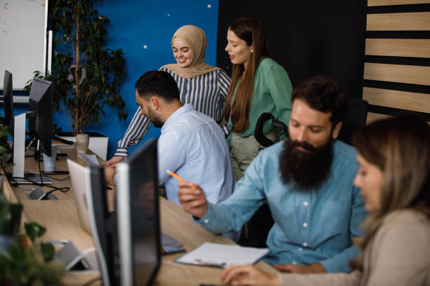 istock Young business people collaborating on various projects in a modern office space 1403985672