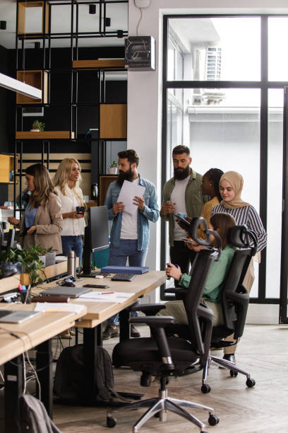 istock Diverse group of business people having a briefing in a modern office space 1403985679