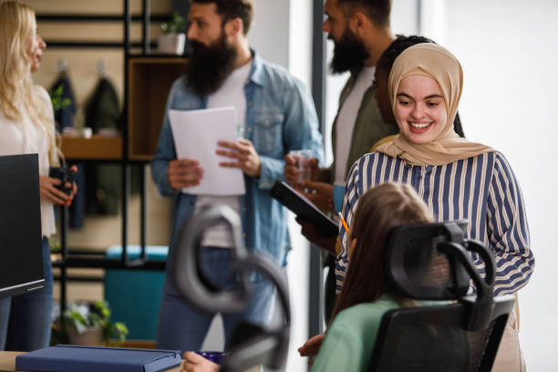 istock Two businesswomen chatting casually during coffee break at the office 1403985711