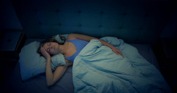 istock Woman in bed can't sleep due to insomnia 1403985824