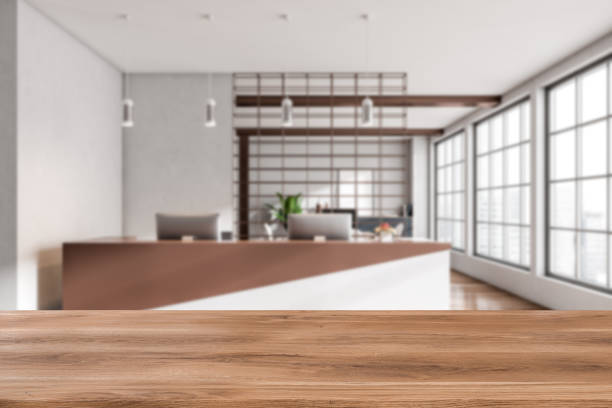 istock Reception interior and wooden desk on blurred background. Mockup 1403988781