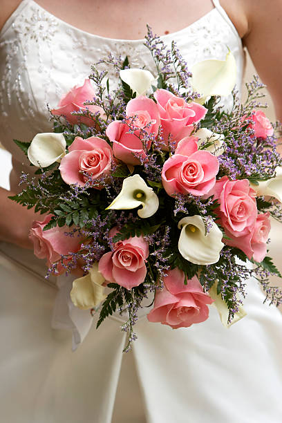 istock Bride holding her flower bouquet on her wedding day 140398909