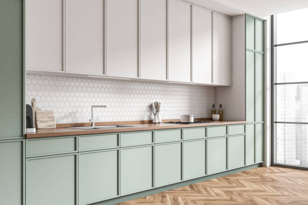 istock Light kitchen interior with shelves and appliances, panoramic window 1403989252