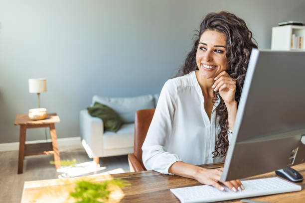 istock Successful businesswoman standing in creative office and looking at camera. 1403989385