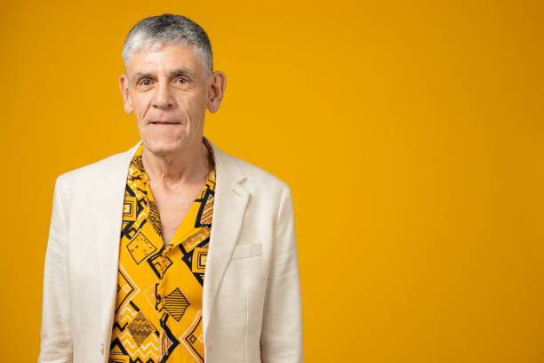 istock Senior man against yellow background 1403989796