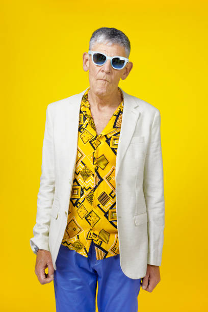 istock Cool senior man against yellow background 1403990035