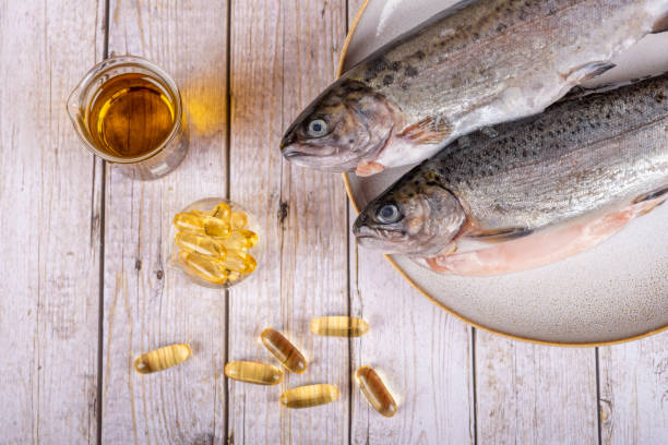 istock Food supplement capsules with oil - omega 3, vitamin A or E - with fish 1403991068