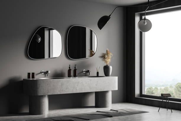 istock Grey bathroom interior with sink and mirror, accessories and window 1403991332