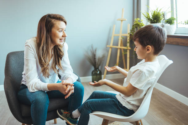 istock Young boy having therapy with a child psychologist. 1403991610