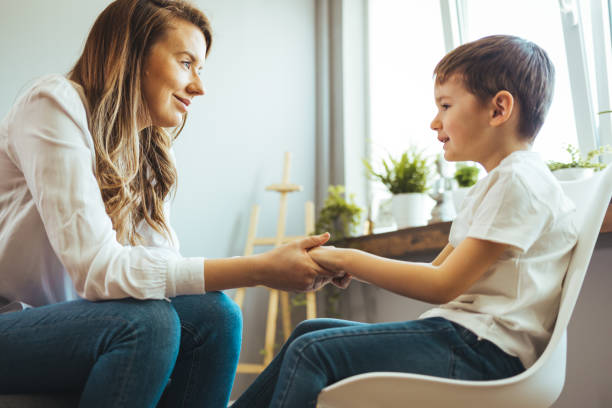 istock Smiling woman talking to boy 1403991618