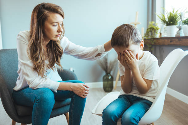 istock Young boy having therapy with a child psychologist 1403991652