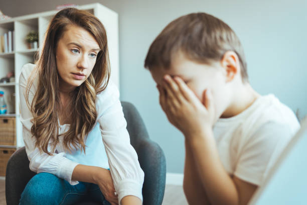 istock Young boy having therapy with a child psychologist 1403991678