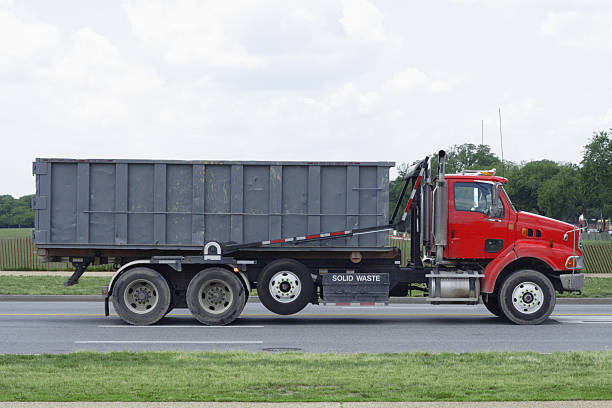 Side View Large Solid Waste Hauling Truck stock photo