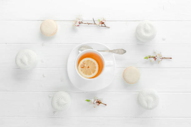 istock Tea with lemon in white porcelain dishware, topivew 1403993490