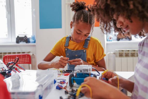 istock Close-up of young STEM class students working robots 1403994267
