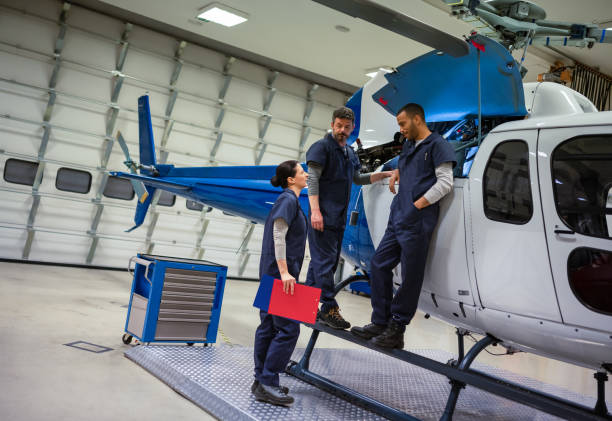 istock Aircraft Mechanics And Engineers In The Hangar 1403994306