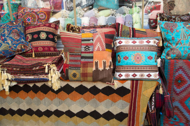 istock Colorful pillows with flowers and patchwork in market in Turkey 1403994321