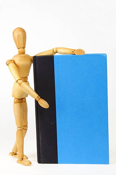 A wooden person presenting a blank book cover