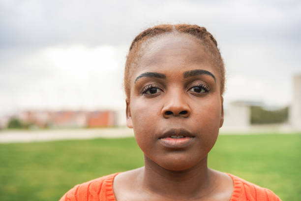 istock Curvy african woman smiling at camera - Focus on face 1403994472