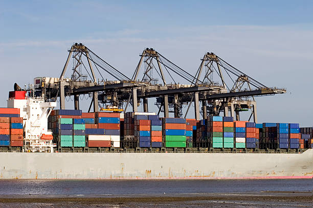 Freight containers A ship being loaded with containers at Southampton docks. All names and logos have been removed from the containers. southampton england photos stock pictures, royalty-free photos & images