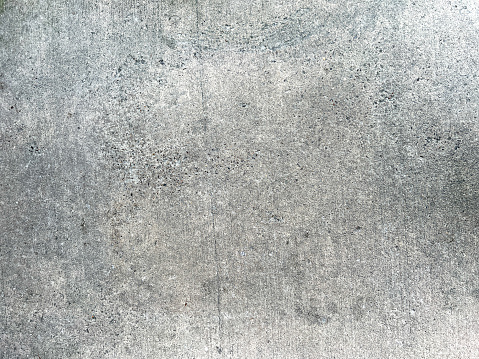 A very fine, light gray and smooth concrete as a texture or background.