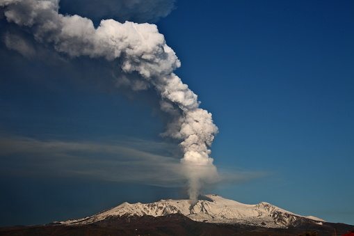 The awakened volcano smokes the sky
