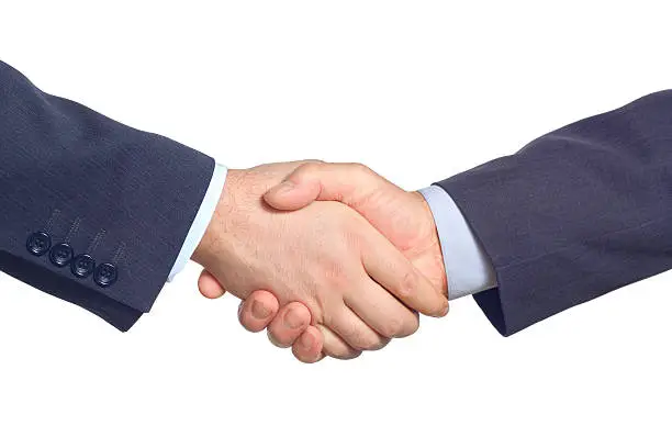 Business handshake against white background