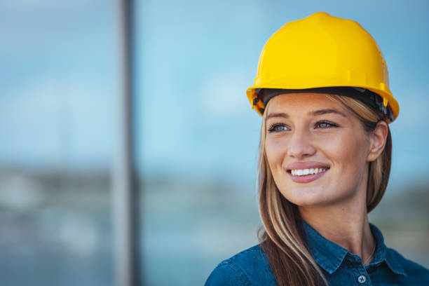 istock Woman engineer at building site looking away 1403996029