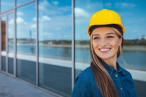 Adult female builder smiling while looking away