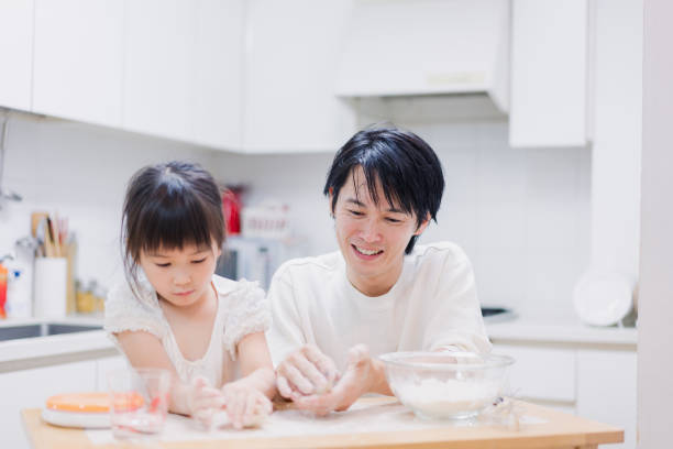 istock Dad kneading dough with his daughter 1403996501