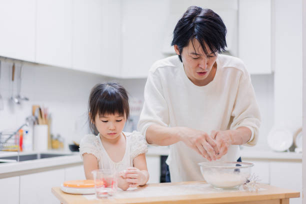 istock Dad kneading dough with his daughter 1403996503