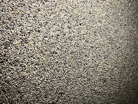 A picture of a wall with small stones as a texture or background.