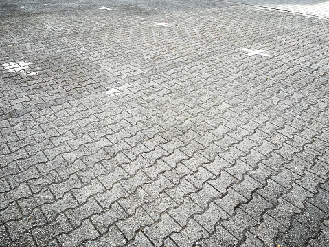 A marked parking space on a paved area.
