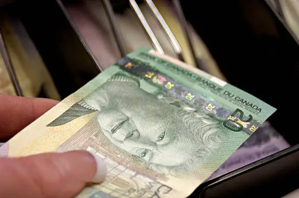 Photo of Canadian Money and Cash Register