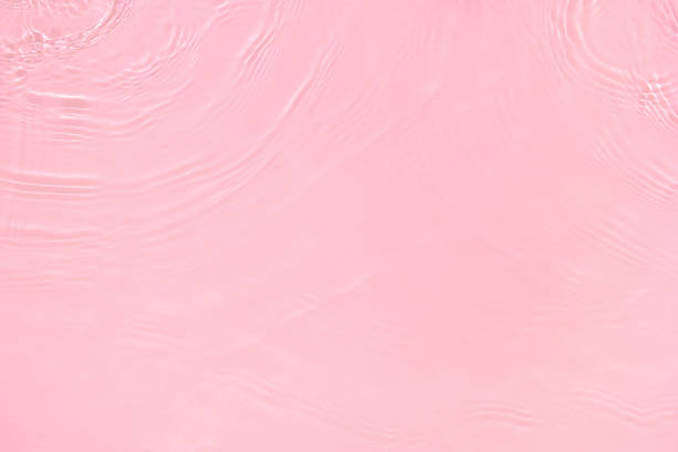 istock transparent pink colored clear calm water surface texture 1403997959