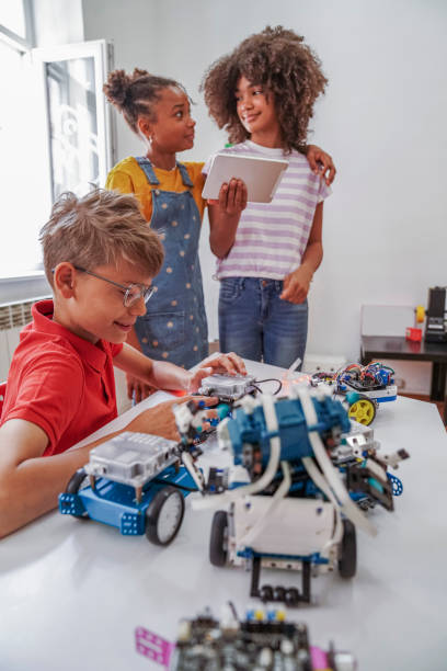 istock Happy kids programming electric toys . 1403997992